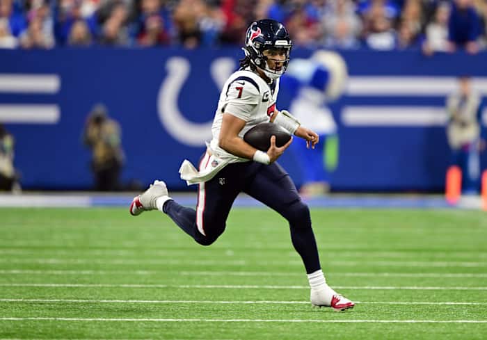 Texans quarterback C.J. Stroud (7) runs the ball against the Indianapolis Colts during the second half at Lucas Oil Stadium.